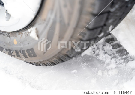 Snowy road and tires 61116447
