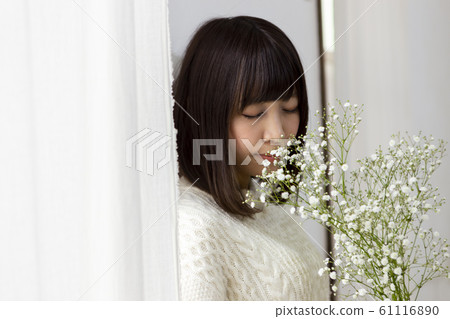 A woman with flowers 61116890