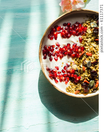 Home made granola bowl with pomegranate 61117371