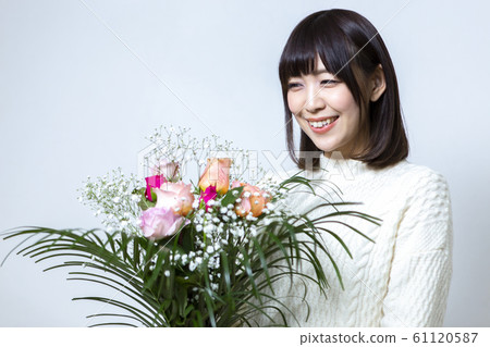 Woman with a bouquet Woman with a bouquet 61120587