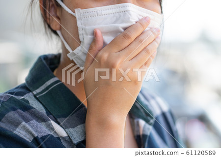 Woman wearing face mask protect filter against air Woman wearing face mask protect filter against air 61120589