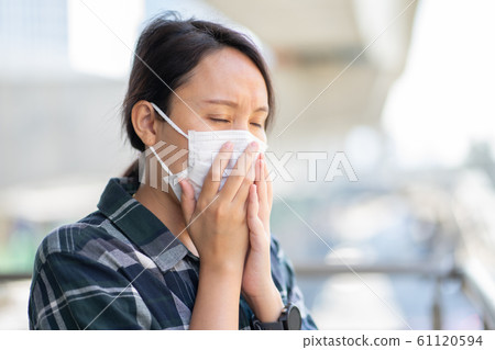 Woman wearing face mask protect filter against air 61120594