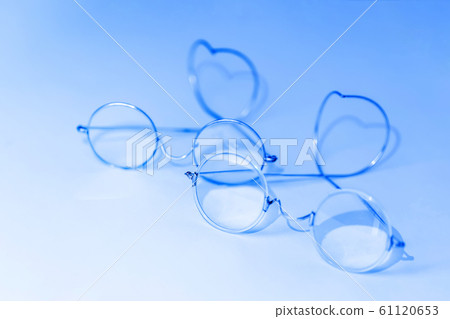 Old fashion glasses on blue background Old fashion glasses on blue background 61120653