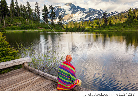 Relaxing on mountain lake Relaxing on mountain lake 61124228