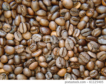 Brown roasted coffee beans Background. 61125405