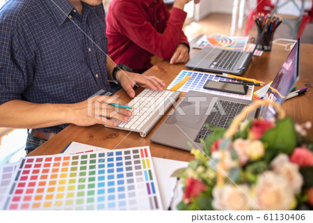 Asian colleagues designer drawing sketches on Asian colleagues designer drawing sketches on 61130406