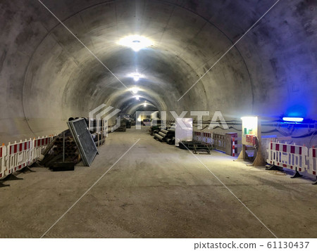 Train tunnel construction with barriers and fresh concrete walls 61130437
