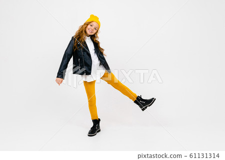 smiling stylish caucasian charming schoolgirl in a white shirt, unbuttoned leather black jacket 61131314