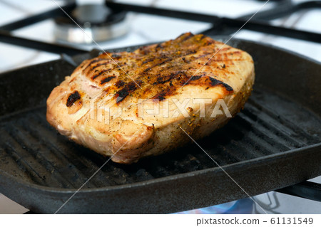 Macro photo of pork meat on grill pan Macro photo of pork meat on grill pan 61131549