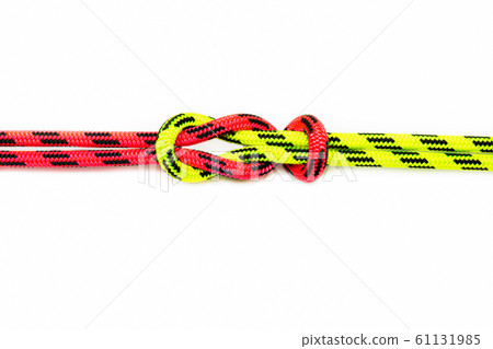 Reef, Hercules, square, double or brother hood Binding knot binding two colored (red and green) ropes. nautical loop used to secure rope or fishing line around an object. Isolated on white background Reef, Hercules, square, double or brother hood Binding knot binding two colored (red and green) ropes. nautical loop used to secure rope or fishing line around an object. Isolated on white background 61131985