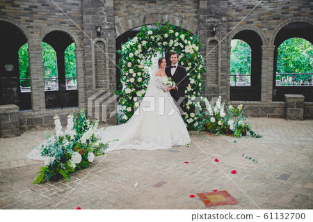 Couple of beautiful and elegant newlyweds on wedding ceremony 61132700