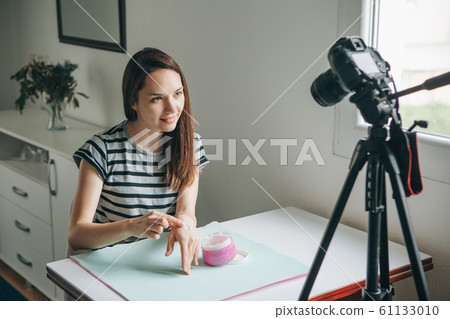 Girl videoblogger records video. Girl videoblogger records video. 61133010