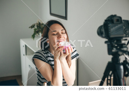 Girl videoblogger records video. Girl videoblogger records video. 61133011