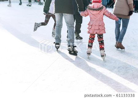 People ride on the skating rink 61133338