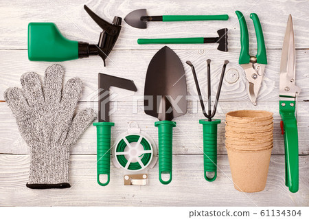 Gardening tools on wooden background flat lay 61134304