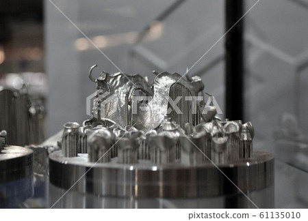Object printed on metal 3d printer close-up. 61135010