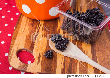 Fresh raw blackberries prepared for cooking jam. Fresh raw blackberries prepared for cooking jam. 61135069