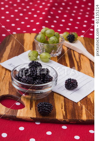 Cooking salad with blackberries and cherry-plums. Cooking salad with blackberries and cherry-plums. 61135214