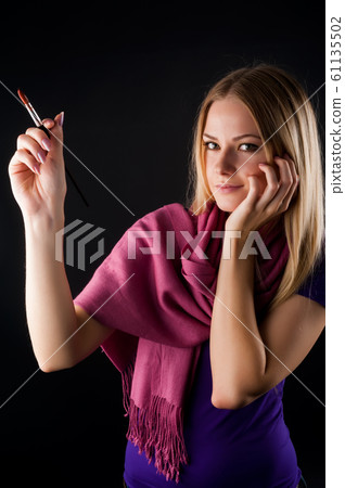 Pretty female painter 61135502