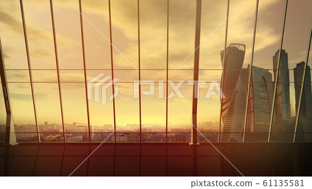 Empty office with view of cityscape with skyscrapers at sunset. Empty office with view of cityscape with skyscrapers at sunset. 61135581