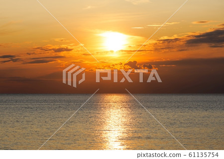 Dramatic sky at sunset near the sea Dramatic sky at sunset near the sea 61135754