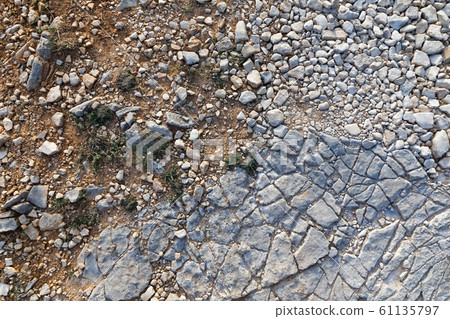 Rough stone surface as background texture 61135797