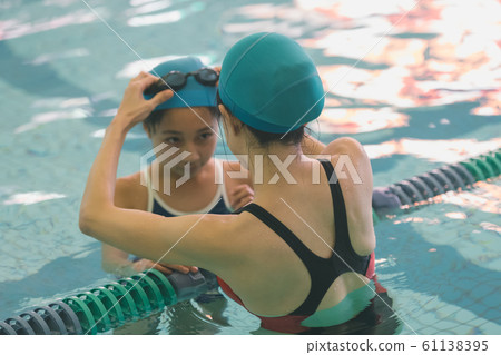 Kids swimming Kids swimming 61138395