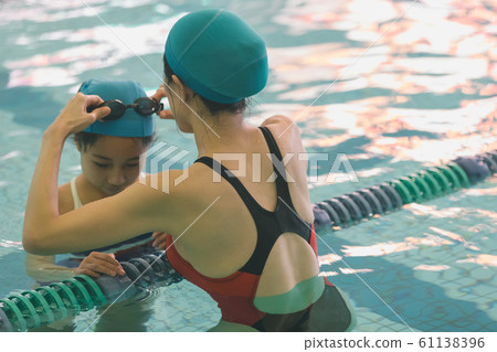 Kids swimming Kids swimming 61138396