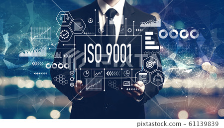 ISO 9001 concept with businessman holding a tablet 61139839