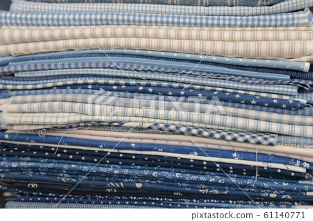 stack of pieces fabric many pattern on shelf, material recycle for clothing fashion design stack of pieces fabric many pattern on shelf, material recycle for clothing fashion design 61140771