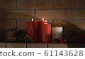 Close up of four burning candles 61143628