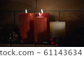 Close up of four burning candles 61143634