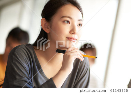 Young woman listening 61145536