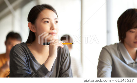 Young woman listening 61145537