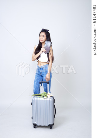 Asian woman with suitcase bright Asian woman with suitcase bright 61147493