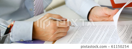 Hand of businessman in suit filling and 61150254