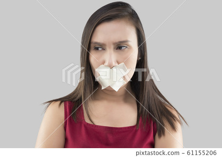 Women use masking tape to close the mouth Women use masking tape to close the mouth 61155206