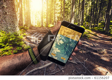Smartphone GPS navigator in man's hand. Smartphone GPS navigator in man's hand. 61156207