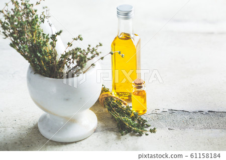 Thyme essential oil in glass bottles 61158184