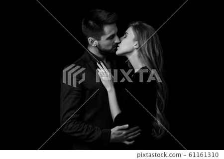 elegant couple in the tender passion. 61161310