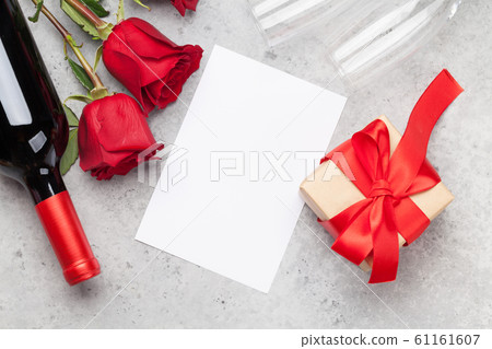 Valentines day with gift, wine and roses Valentines day with gift, wine and roses 61161607