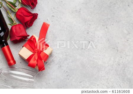 Valentines day with gift, wine and roses Valentines day with gift, wine and roses 61161608