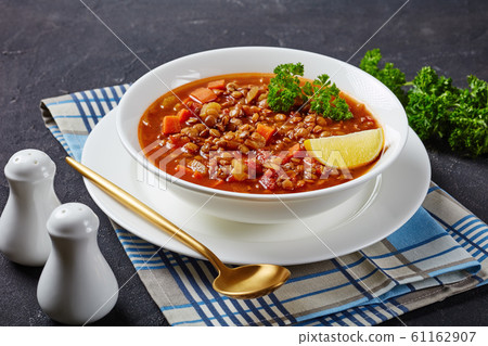 close-up of lentil soup in a white bowl 61162907