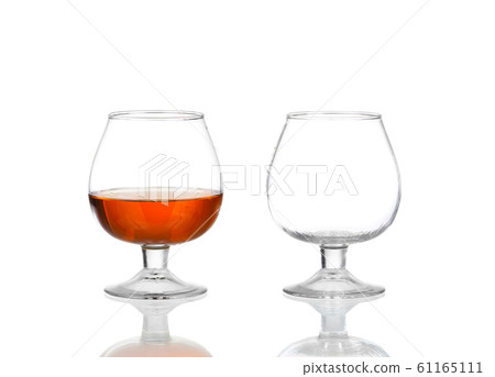Two brandy glasses (empty and with alcohol) 61165111