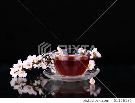 cup of tea and cherry branch cup of tea and cherry branch 61166185