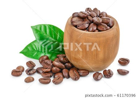 Heap of roasted coffee beans in wooden bowl with leaves isolated on white background. 61170396