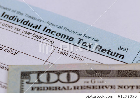 American tax form and and US 100 dollar bills American tax form and and US 100 dollar bills 61172059
