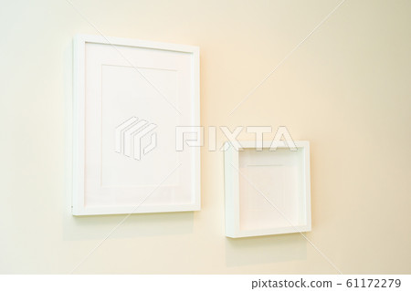 Empty photo frame on wall decoration interior Empty photo frame on wall decoration interior 61172279