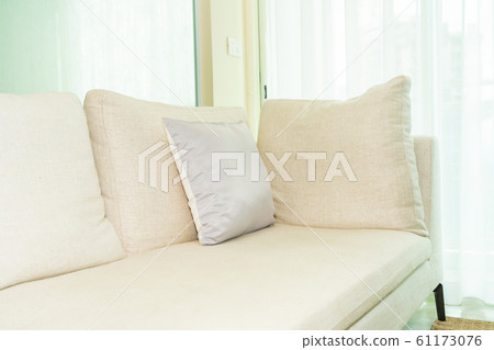 Comfortable pillow on sofa decoration with light lamp interior 61173076