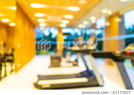 Abstract blur gym room interior with fitness equipment 61173077